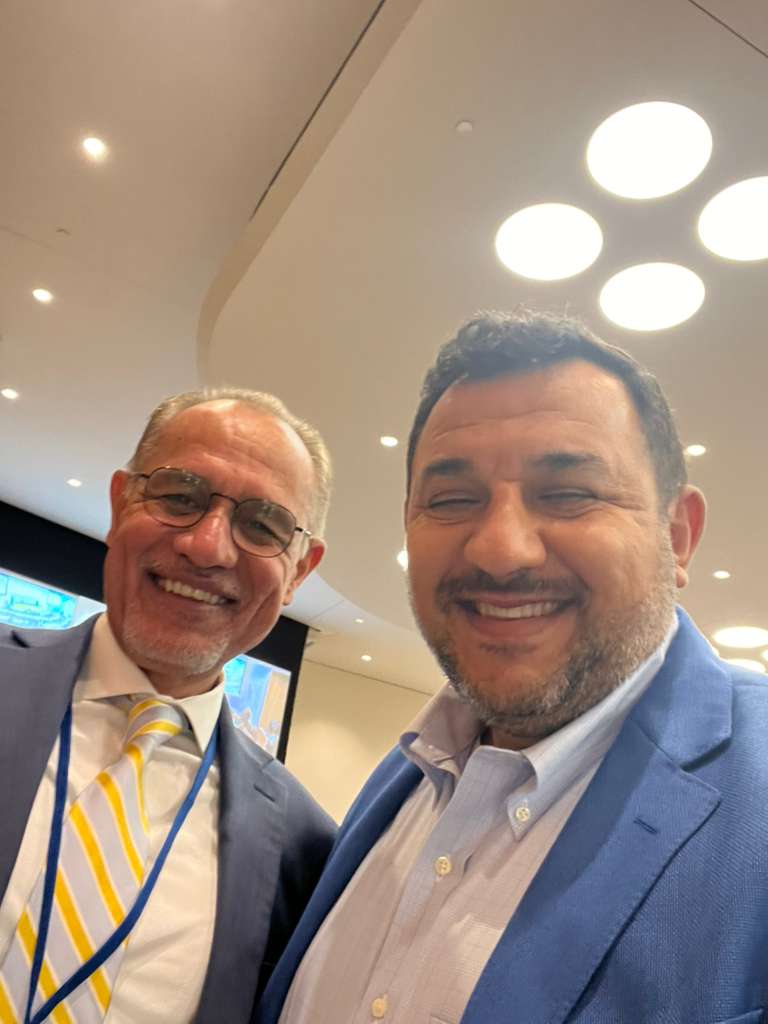 Humam Rajab with a conference participant