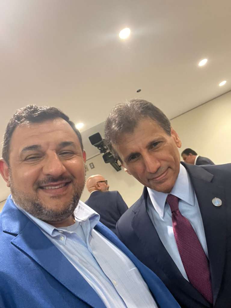 Humam Rajab with a diplomatic partner at the conference