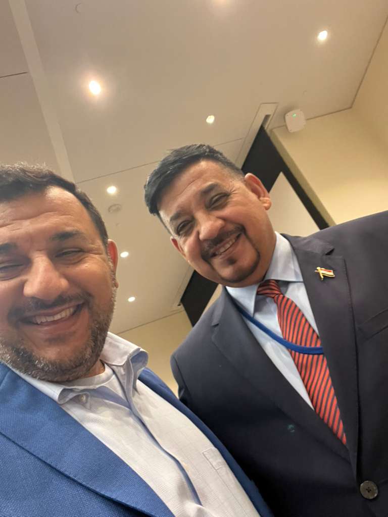 Humam Rajab with an Iraqi conference delegate